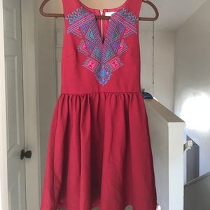 Embroidered day or night mid length dress.